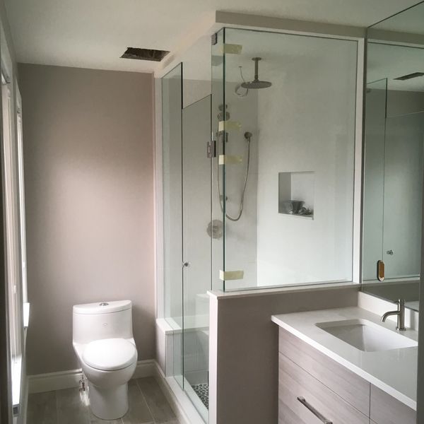 Bathroom with glass shower enclosure.