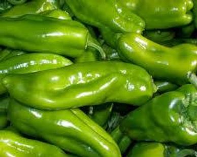 Fresh green peppers piled together.