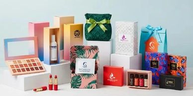 A display of colorful cosmetic and skincare product packaging.