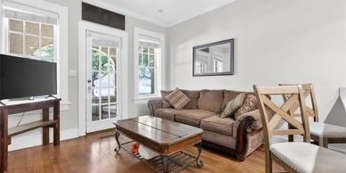Cozy living room with sofa and TV.