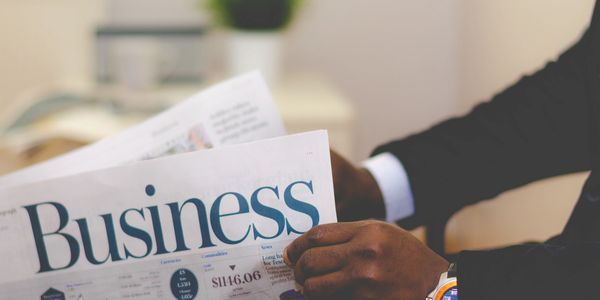 Man reading business newspaper