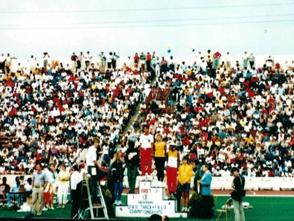 Lynn accepting top honors at the 1987 California State High Jump Championship.