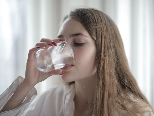 Woman drinking a glass of water