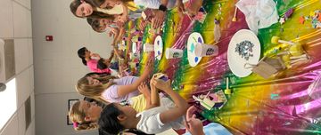 Children engaged in a colorful arts and crafts activity.