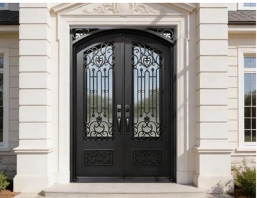 Elegant black wrought iron double doors with intricate scrollwork at a grand entrance.