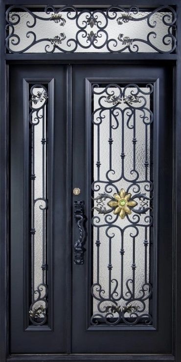 Elegant black door with ornate wrought iron and a golden flower centerpiece.