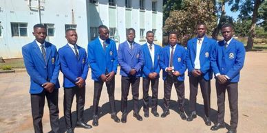 Boys in school uniform standing in line 