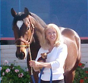 Owner Beth Byrne posing with a horse