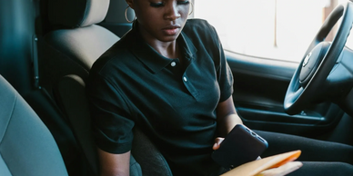 Image shows a legal courier delivering a package.