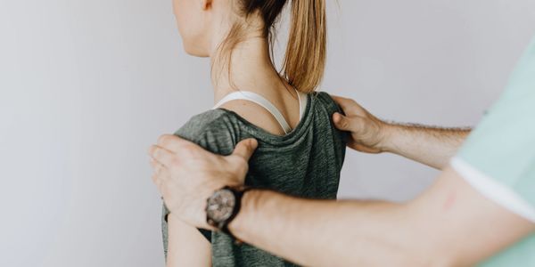 A chiropractor improving posture of patient through expert manual techniques