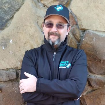A happy Pest control technician providing affordable services in Joplin, MO