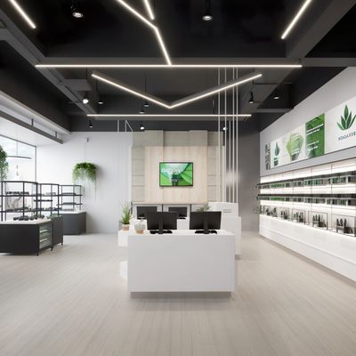 The inside of a retail store shows a centrally located point of sale counter.