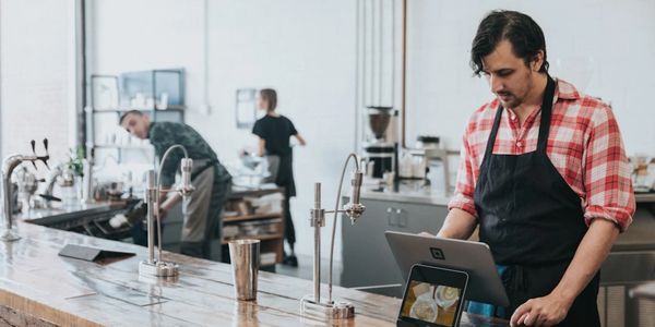 Employee using a POS system