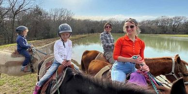 Family horseback trail ride at Chisholm Trail Rides—safe, fun, kid-friendly outdoor Texas ranch.
