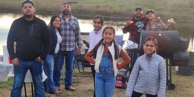 Family event by the pond at Chisholm Trail Rides—country ranch gatherings and outdoor fun.
