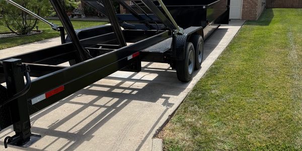 Amarillo dumpster rentals dropping off a roll-off dumpster