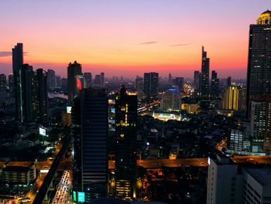 Top view of a city with night lights and long buildings