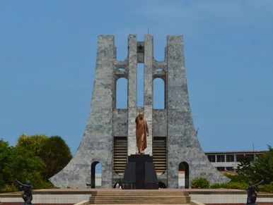 Statue of Buddha in front of a structure