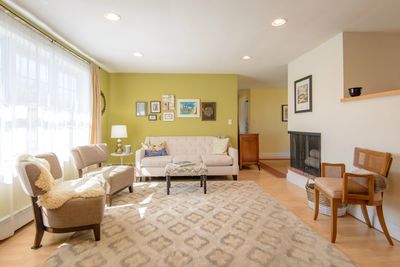 Bright living room with stylish furniture and art.