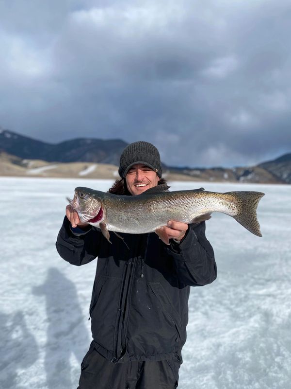 Jeremy with his Trophy rainbow trout here on Eagle Nest Lake 