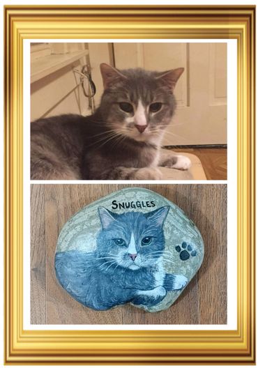 Painted rock of a cat.