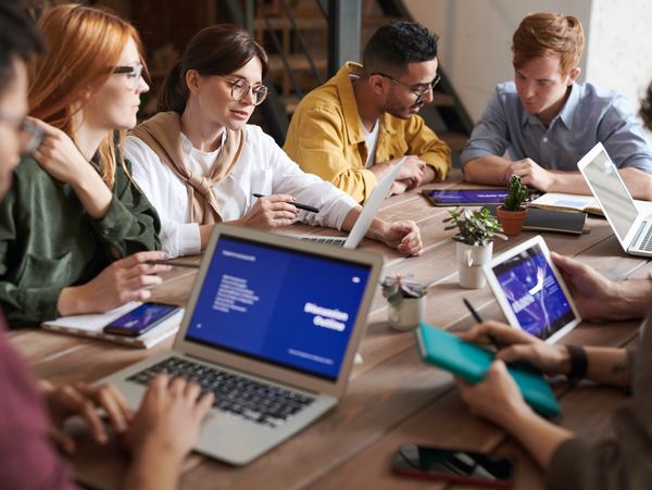 A group of people having a meeting to discuss