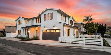 Farmhouse style home at sunset