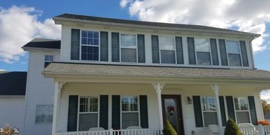 White siding & dark shutters on a home by Universal Interiors in Leitchfield, KY. #ExteriorRemodel

