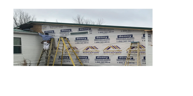 Workers build addition Universal Interiors in Clarkson, KY, using ladders. #SidingInstallation

