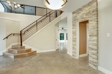 Ledger stone nicely frames this entrance and the iron railing is stunning!