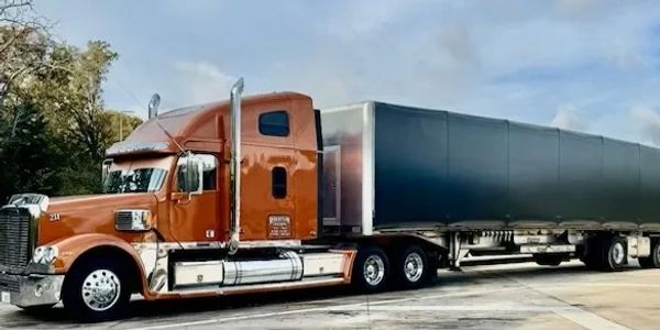 Robertson Trucking Facebook page. Flatbed Conestoga Carrier. Flatbed transportation company