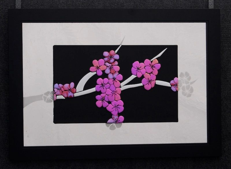 Made of fused dichroic pink, from the side the pink looks yellow, green.  Approx. 24"x20"