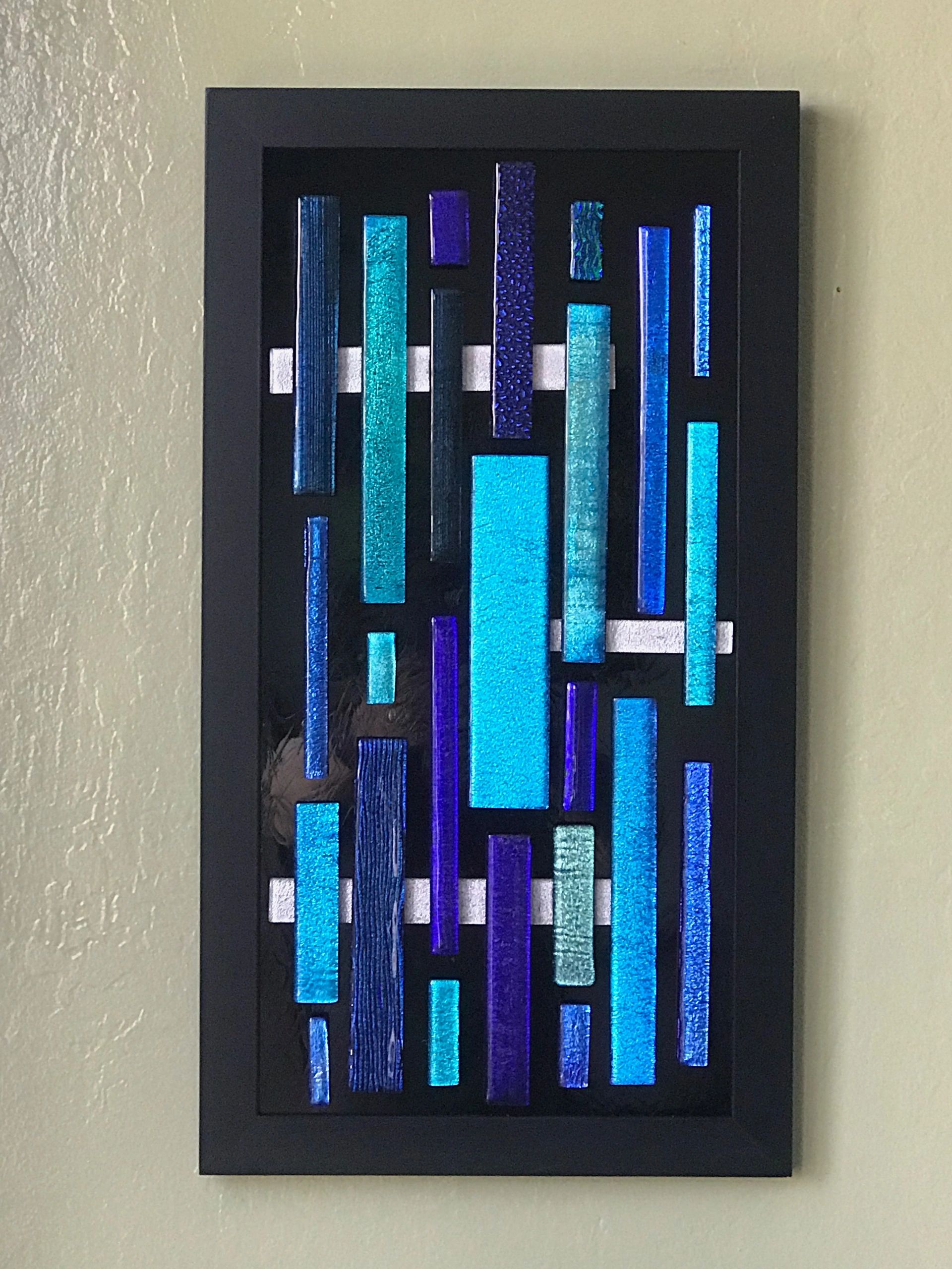 Dichroic pieces attached to a black antique mirror that has been silvered.  Approx. 15"x20"
