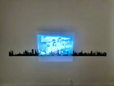 City skyline wall decal under a projected image.
