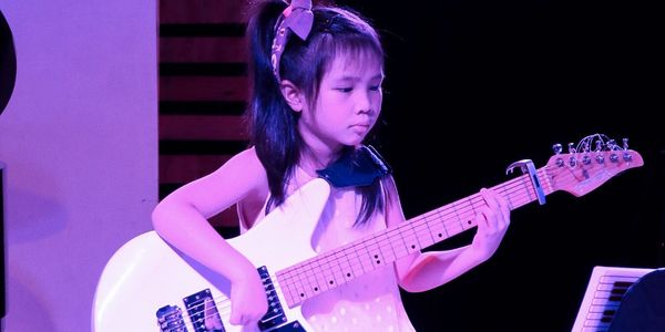 Our youngest guitar student, Naomi