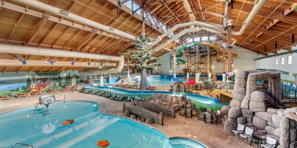 Overall waterpark image showing activity pool, lazy river, wave pool and waterslides