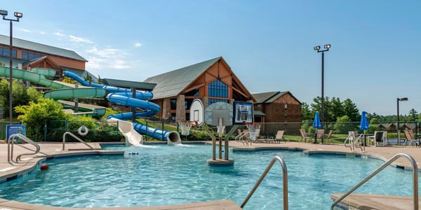 Outdoor waterpark activity pool with basketball hoops 