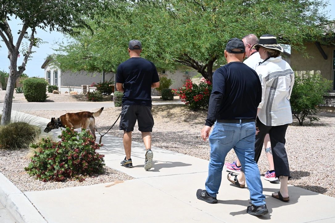 Guardian trainer arriving at a client home with their new protection dog