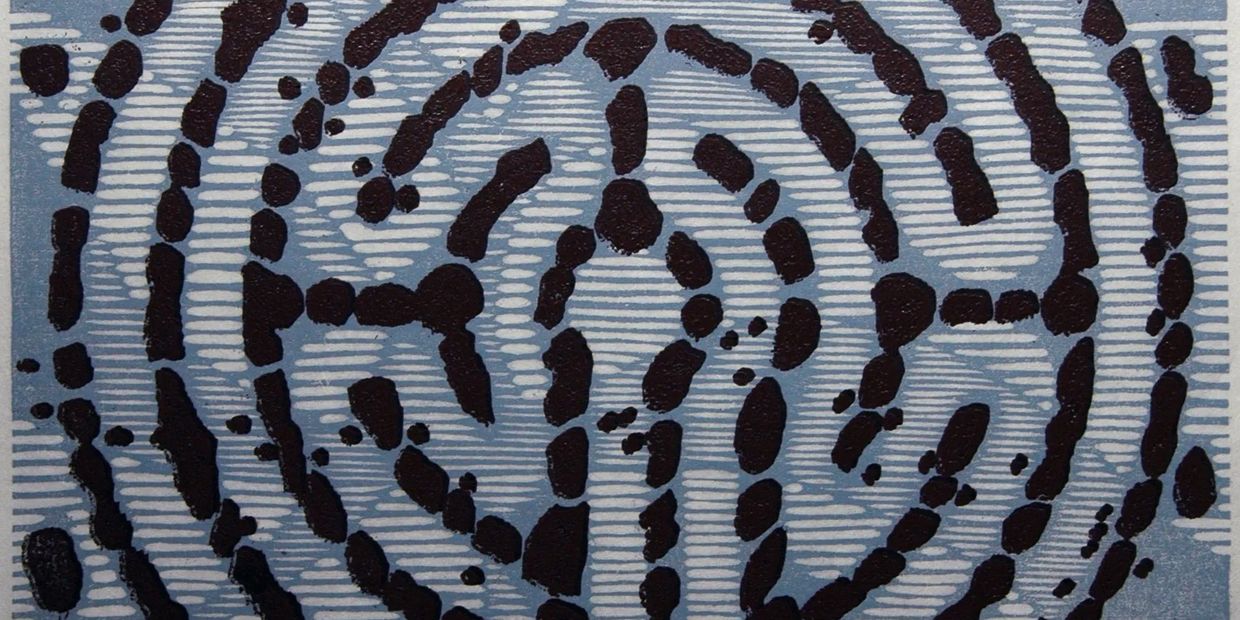 Abstract circular pattern with black dots on a blue and white striped background.