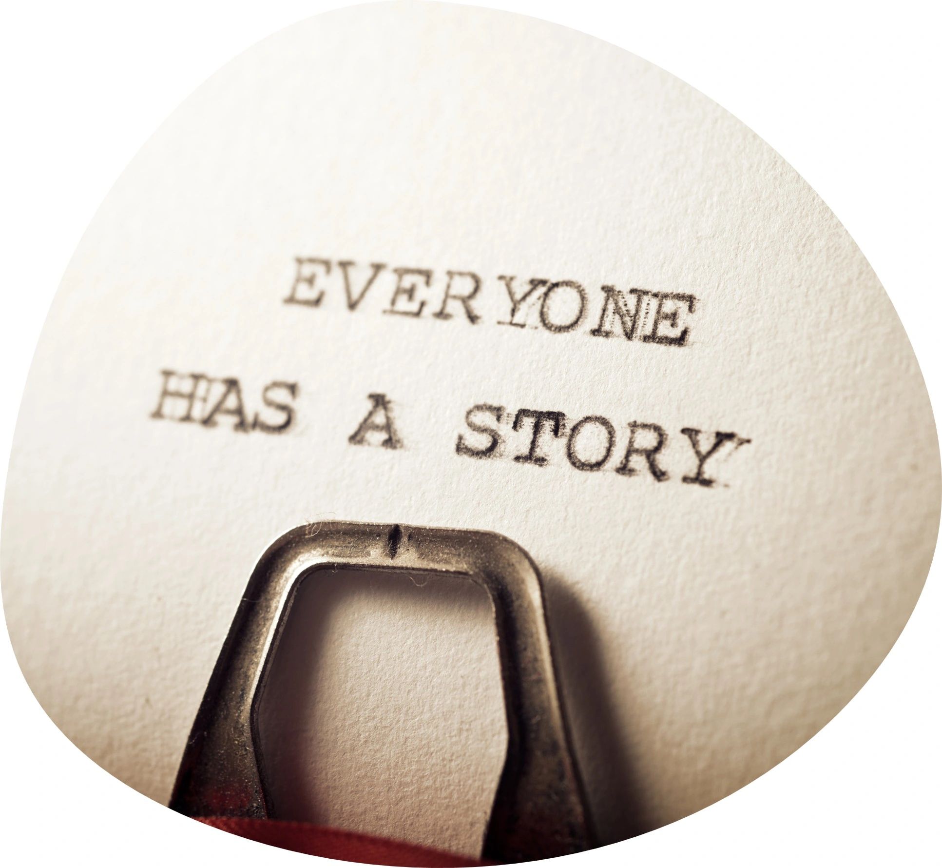 Close-up of typewriter keys with the words "Everyone has a story" typed.