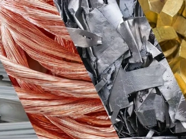 Close-up of copper wires, aluminum scraps, and gold nuggets.