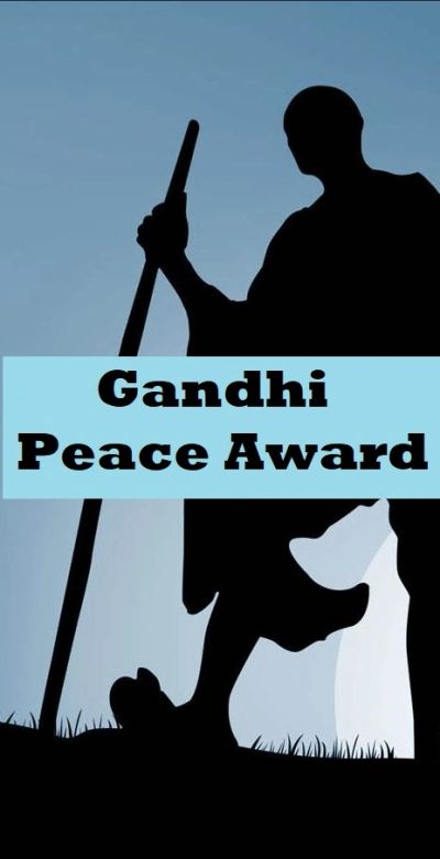 Silhouette of Gandhi with text 'Gandhi Peace Award' on blue background.