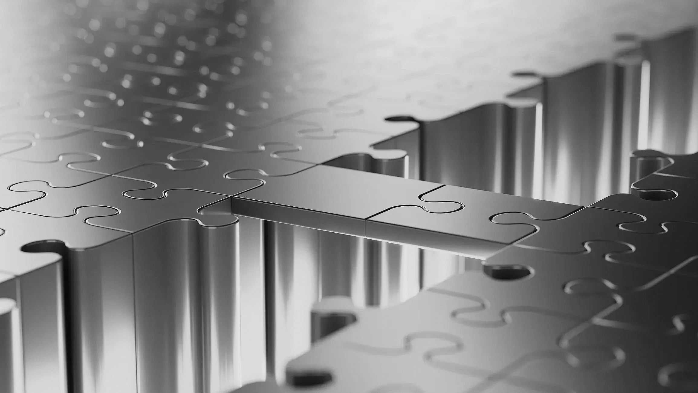 Metal puzzle pieces forming a bridge over a gap.
