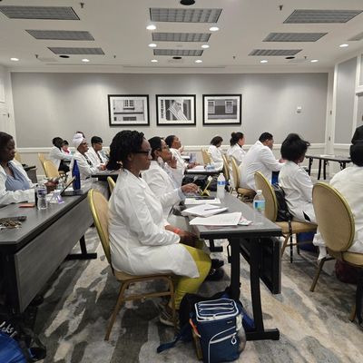 Medical professionals attending a training session in a conference room.