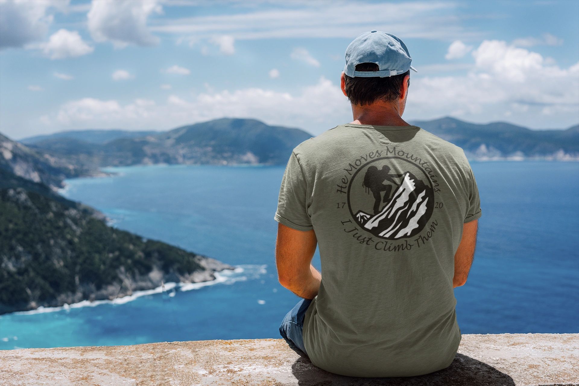 Rock climber wearing a Jesus shirt on a mountain.