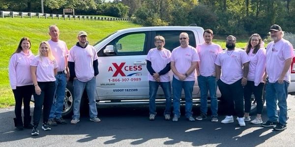 Axcess group photo pink out 