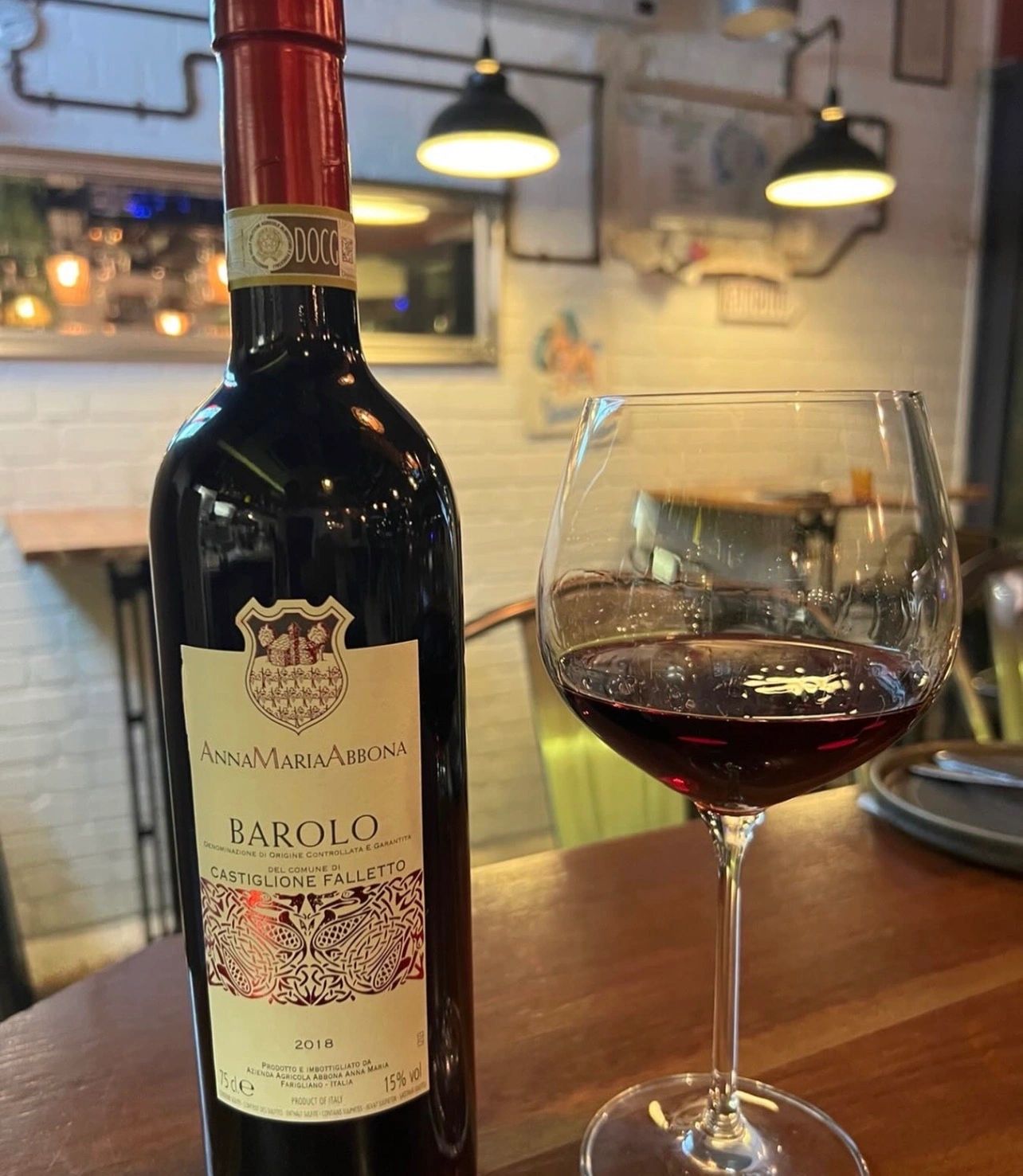 Italian wine bottles and glassware ready for service