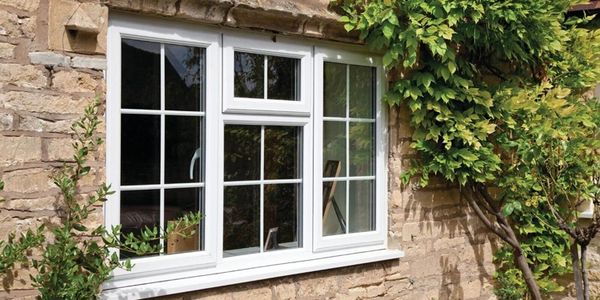 Georgian bar white UPVC double glazed window installed in a cottage