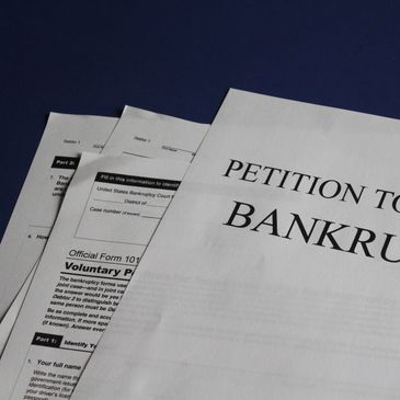 Close-up of a bankruptcy petition document on a table.