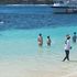 Children playing in the ocean. 